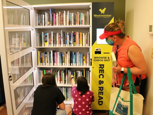 Family using kiosk at City Park Fitness Center